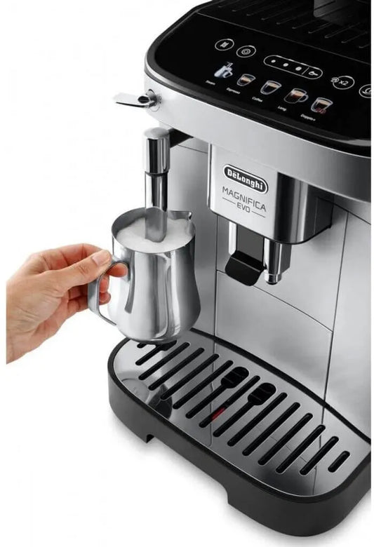 De'Longhi espresso machine with a hand holding a milk frothing pitcher on a white background