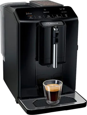 Black coffee machine with a glass of coffee on a white background